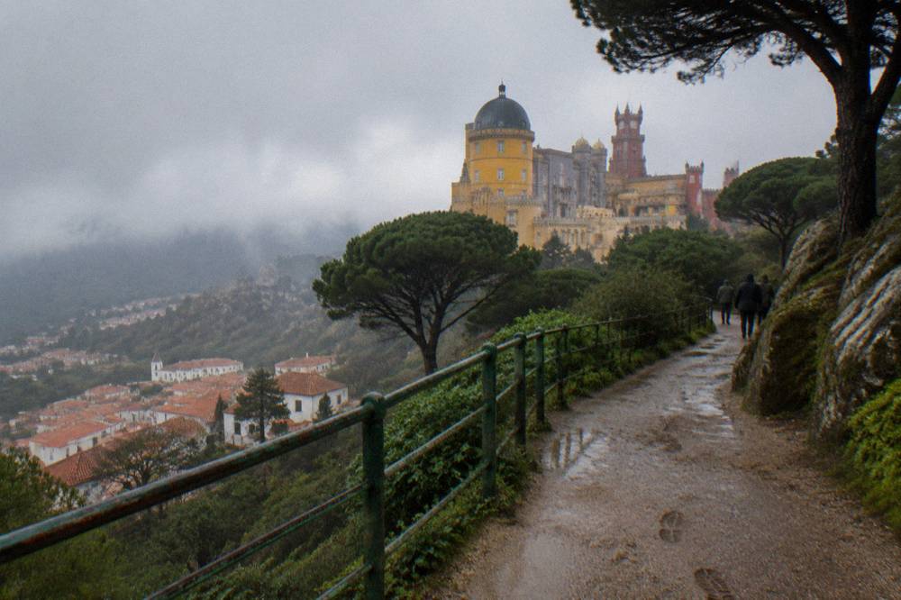 The terracotta rooftops of Sintra old town seen from a hillside path