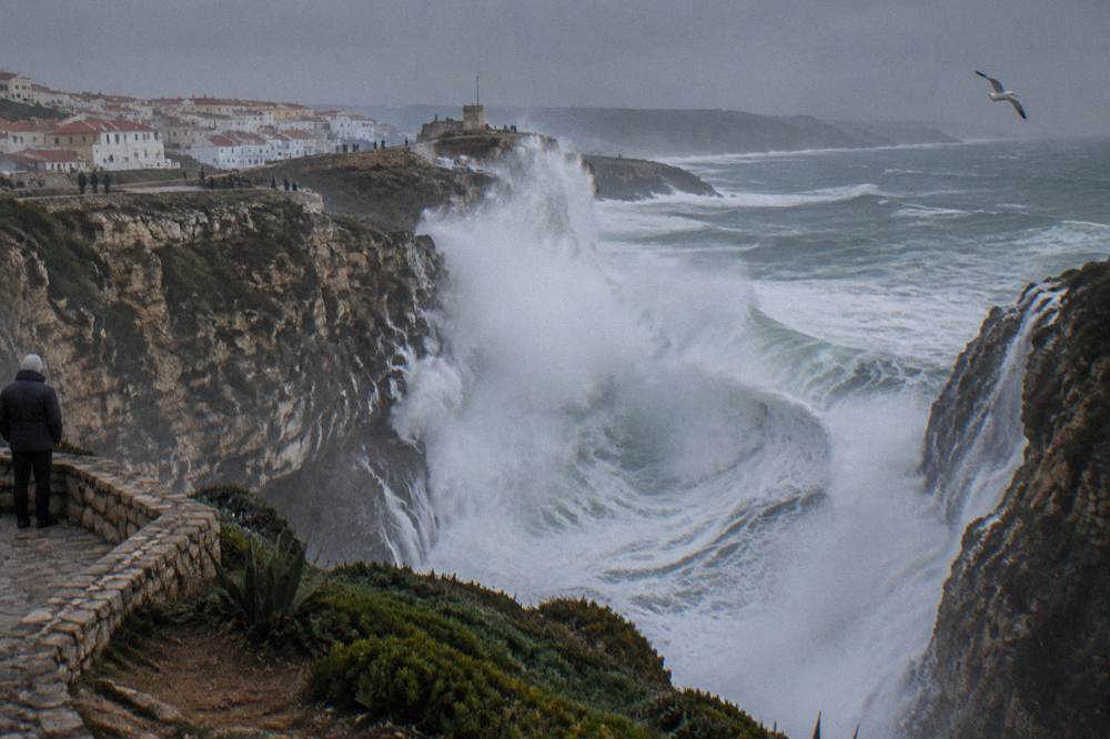 Ocean waves crashing into a rocky cliff chasm on the Atlantic coast
