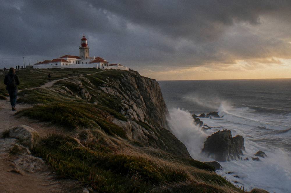 Cliff edge at Cabo da Roca with the Atlantic Ocean beyond the lighthouse
