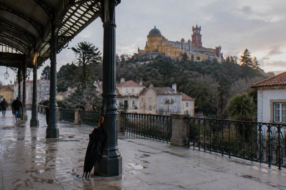 The Sintra train station platform with the historic town buildings behind it in soft light